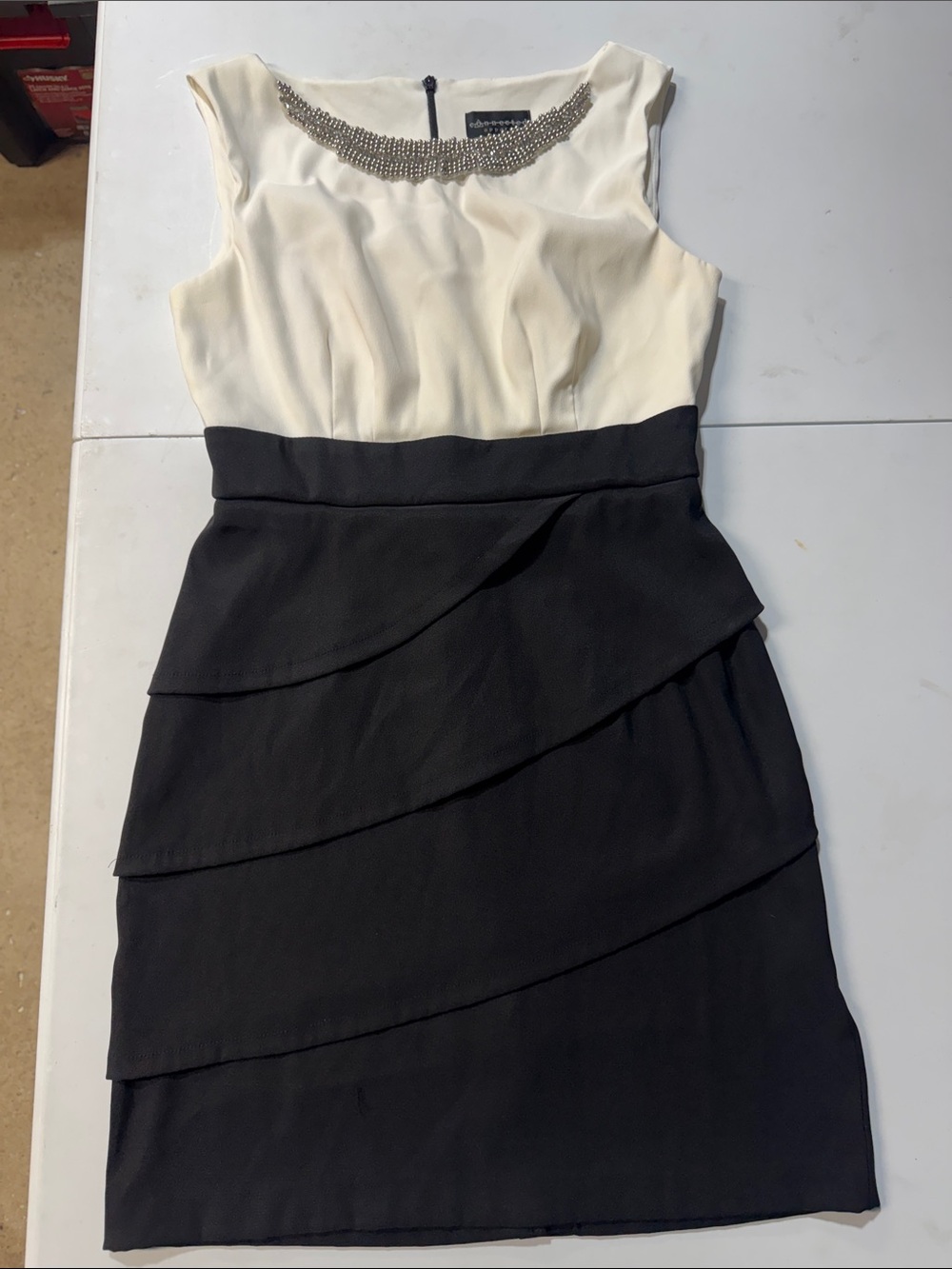 Sleeveless Two-Tone Black & Cream Sheath Dress with Embellished Neckline